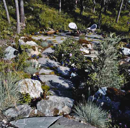 Mary and James take all necessary precautions when enjoying the fire pit on their green roof. Mary’s son is a firefighter, so they know the rules. The garden is always well-hydrated, and the stone patio surround reduces fire risk.